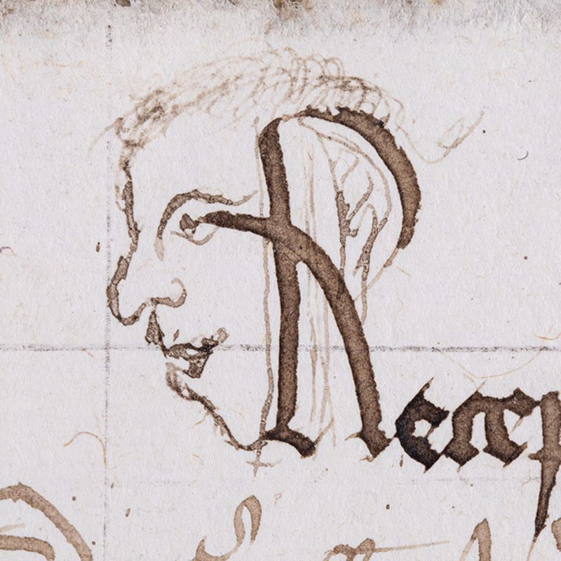 Tête d'un personnage insérée dans un titre secondaire (année 1412 - folio 5)